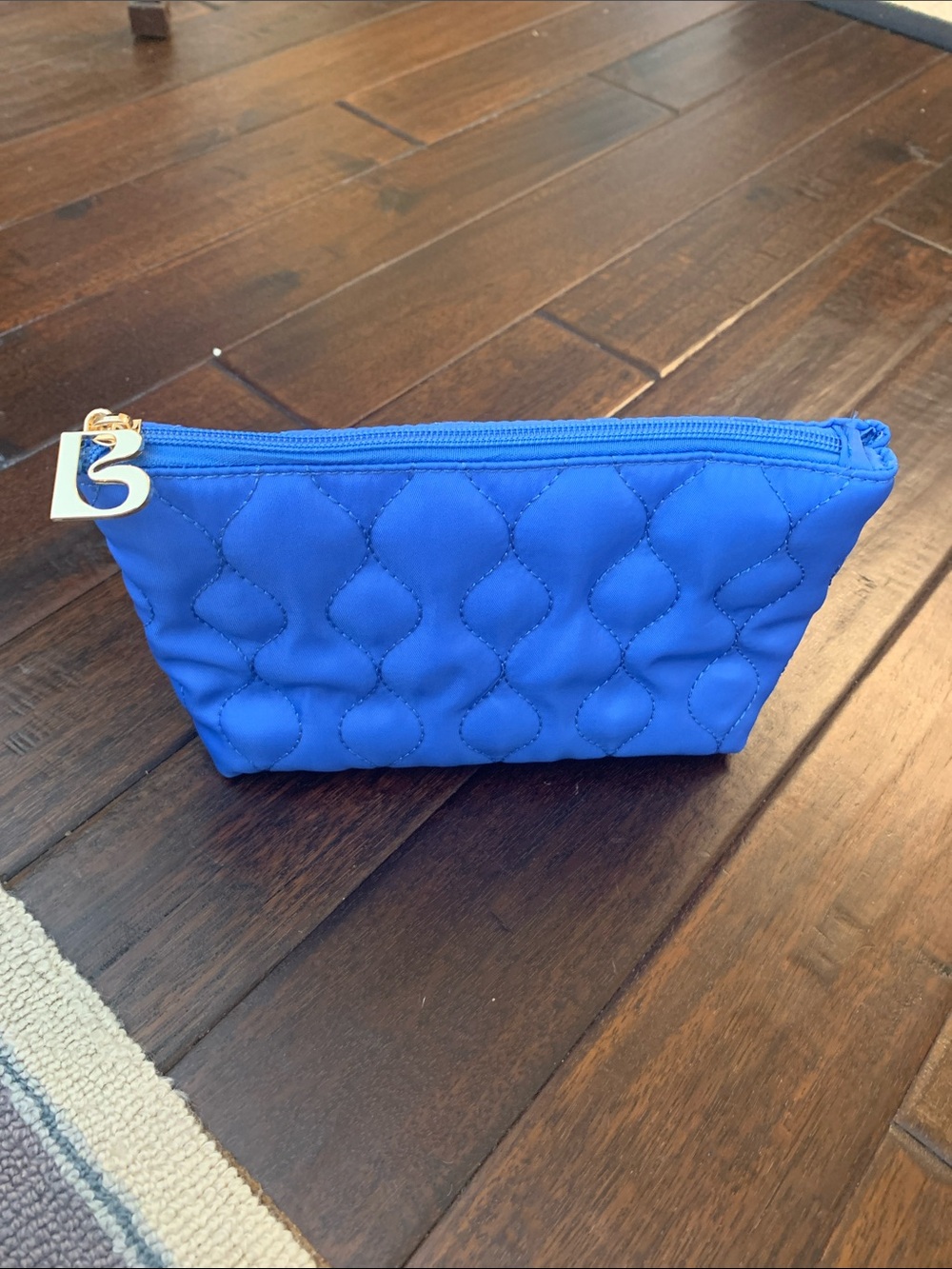 Quilted Cosmetic Pouch - Blue Mercury with gold B zip pull -like new!